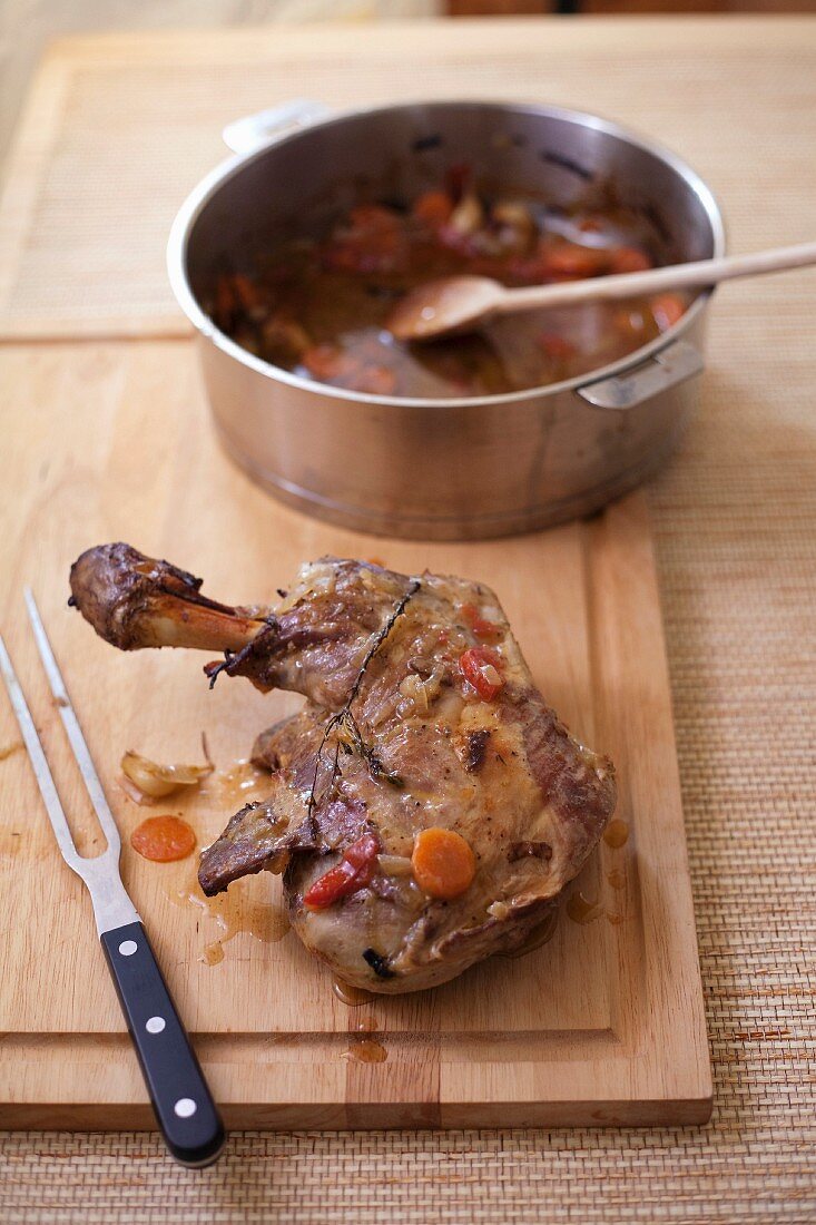 Shoulder of lamb with carrots and garlic