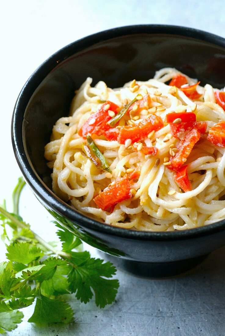 Chinese noodles sauteed with red peppers and sesame seeds