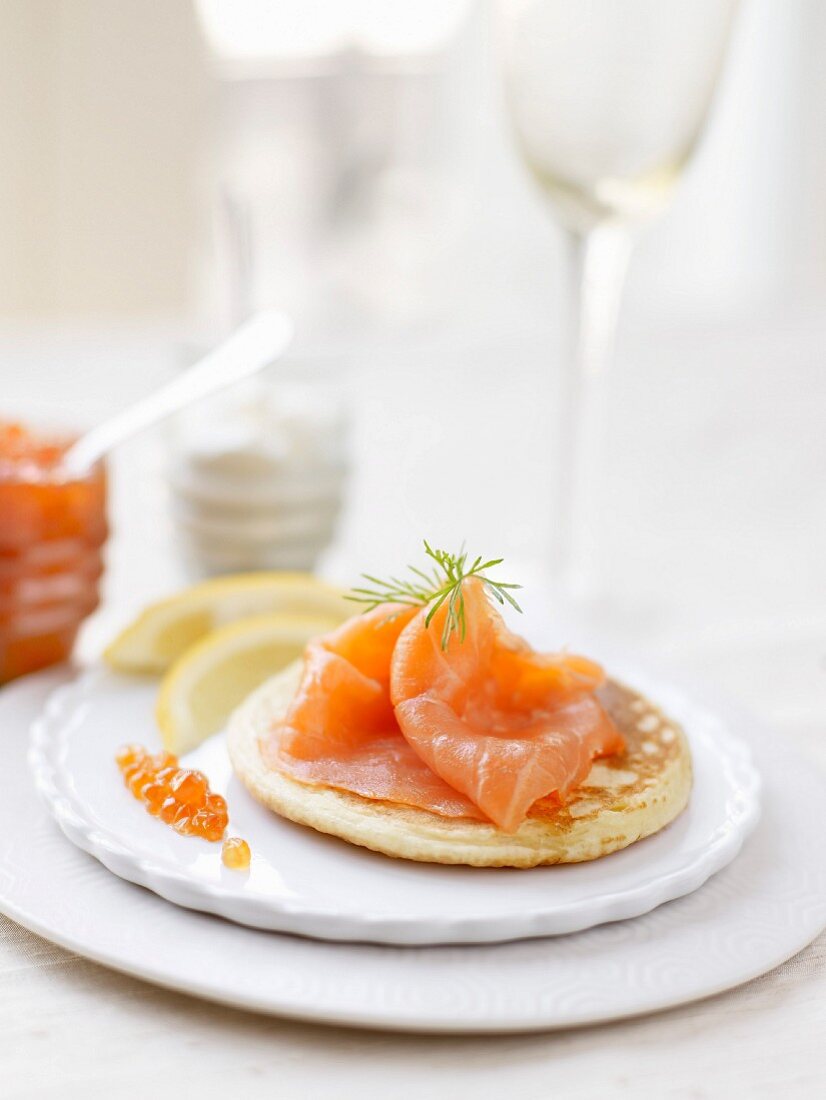 Blini topped with smoked salmon and salmon roe