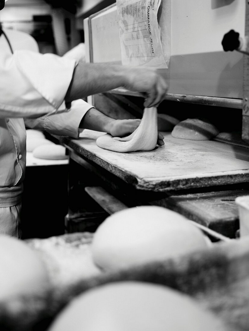 Person preparing bread