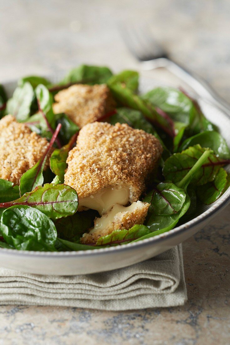 Crispy melting Camembert with baby spinach salad