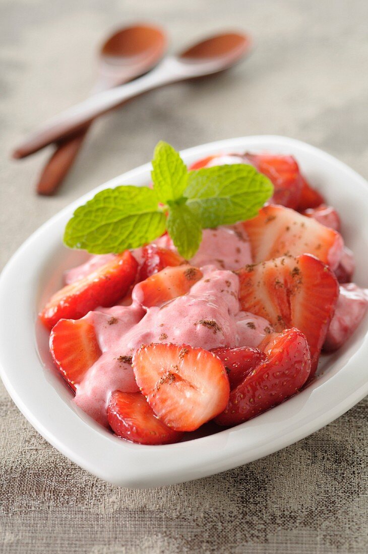 Strawberry fruit salad with whipped fromage blanc and strawberry sauce