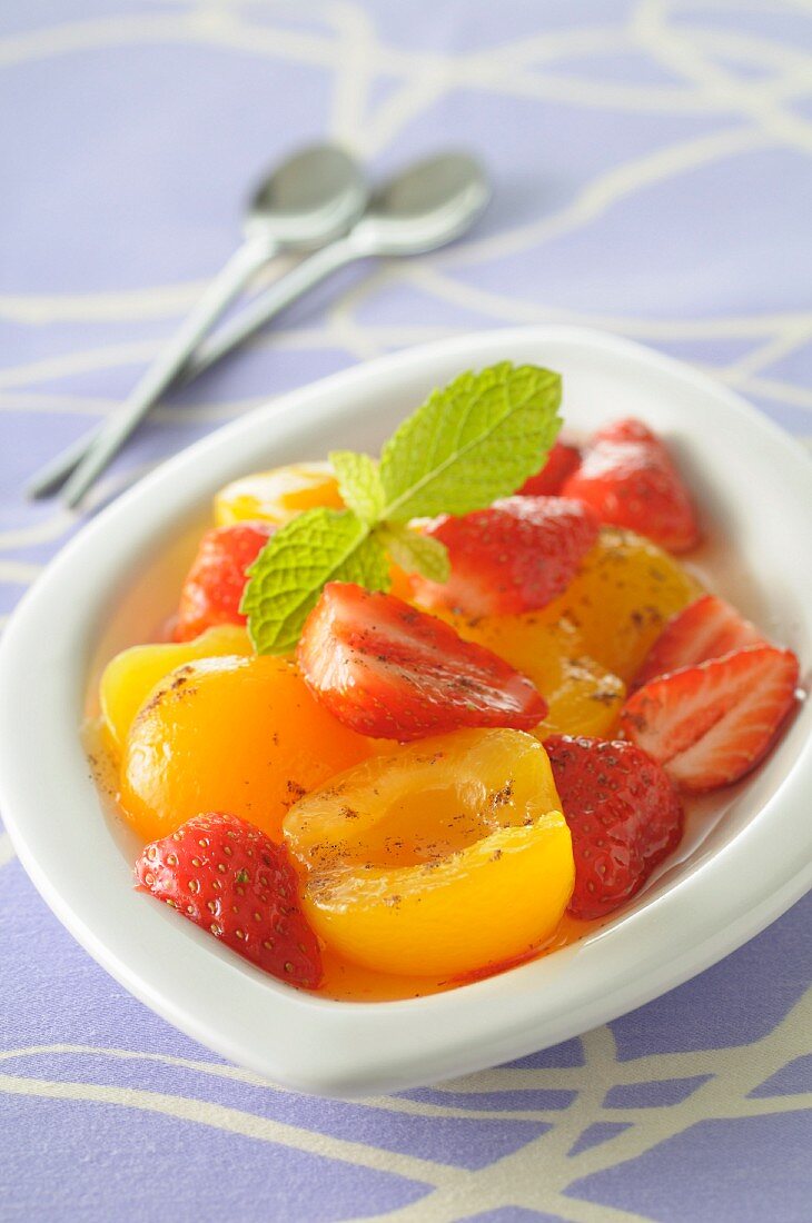 Apricot and strawberry fruit salad in syrup