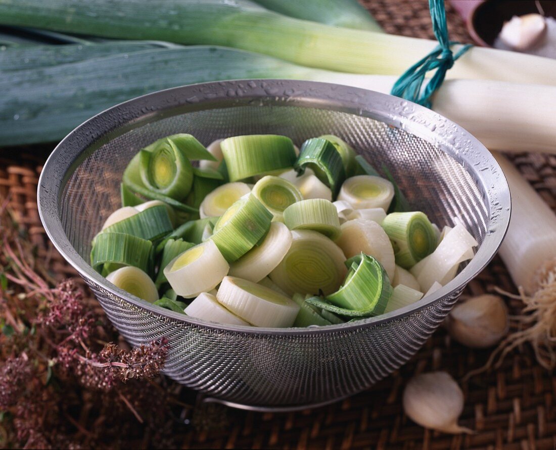 Washed and sliced leeks in a colander