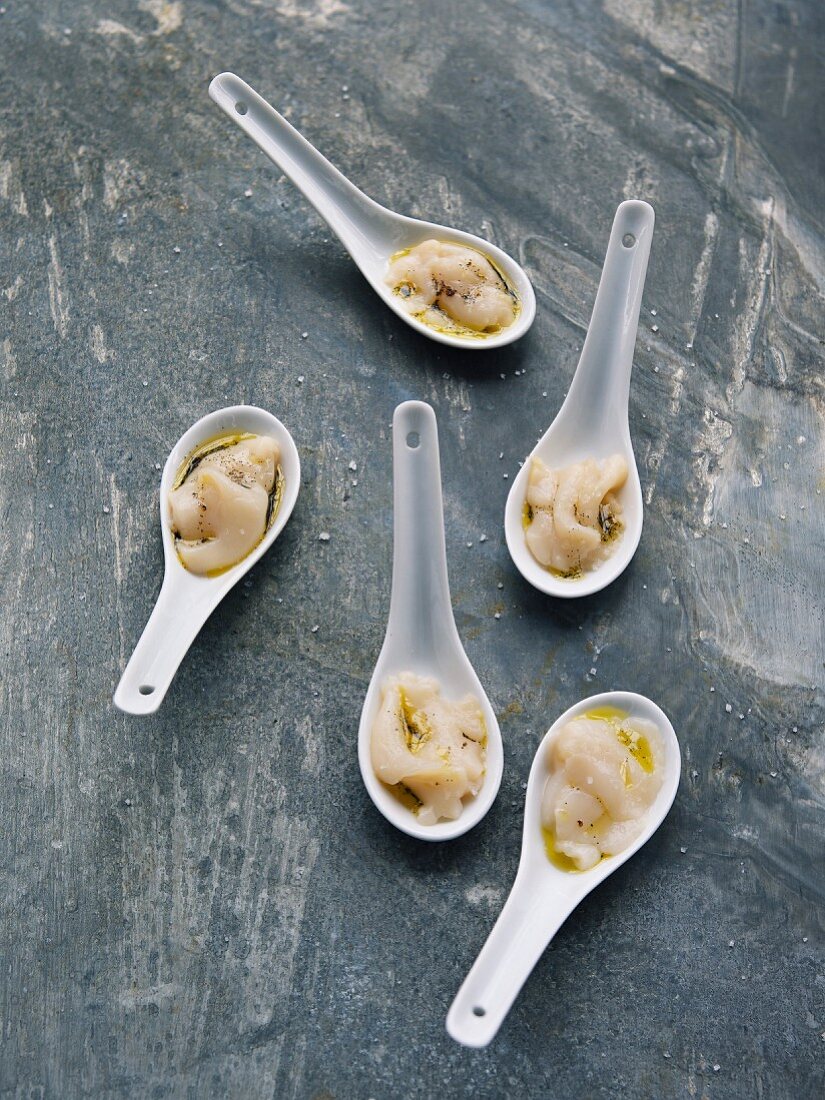 Raw scallop and vanilla-flavored oil appetizers