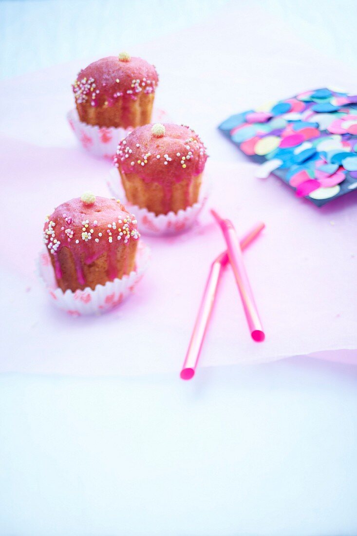 Vanilla cupcake-style Cannelés with raspberry frosting