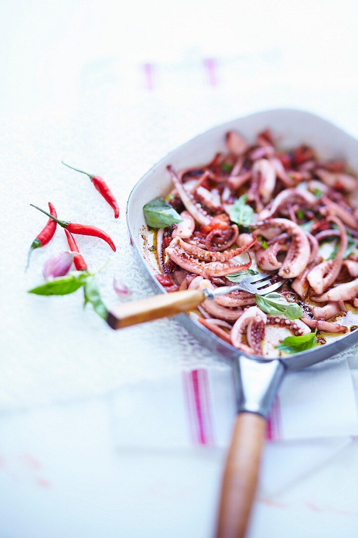 Pan-fried squid with basil and red chili peppers