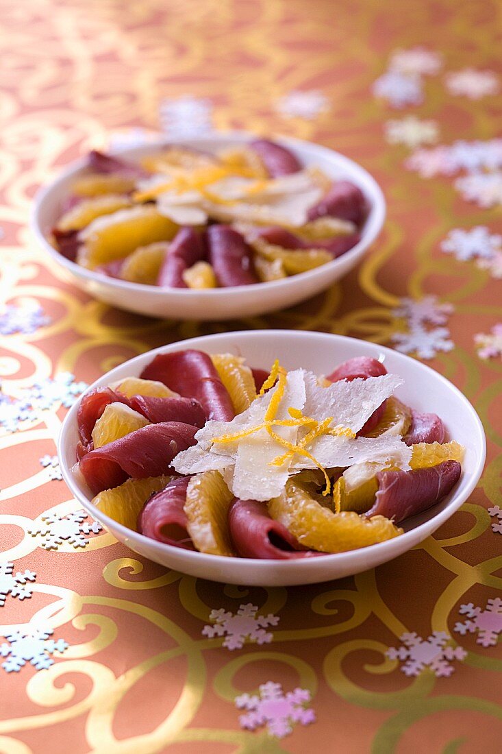 Smoked duck magret carpaccio with orange and parmesan