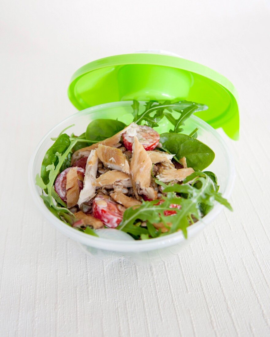 Take-away rocket lettuce,spinach,tomato and smoked turkey salad in white dressing