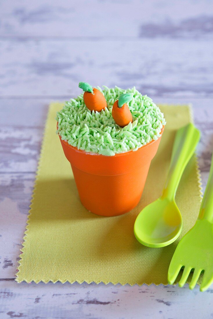 Funny carrot and flower pot cupcake