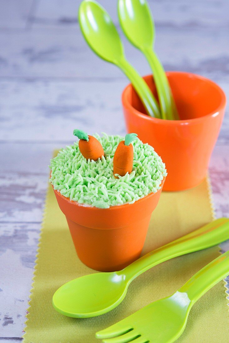Funny carrot and flower pot cupcake