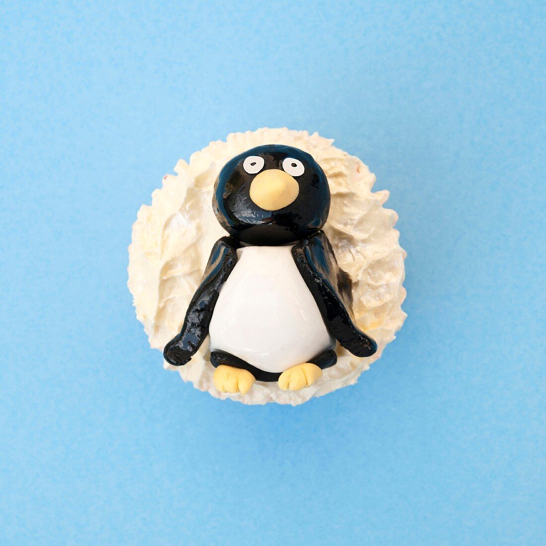 Cupcake topped with a sugar penguin