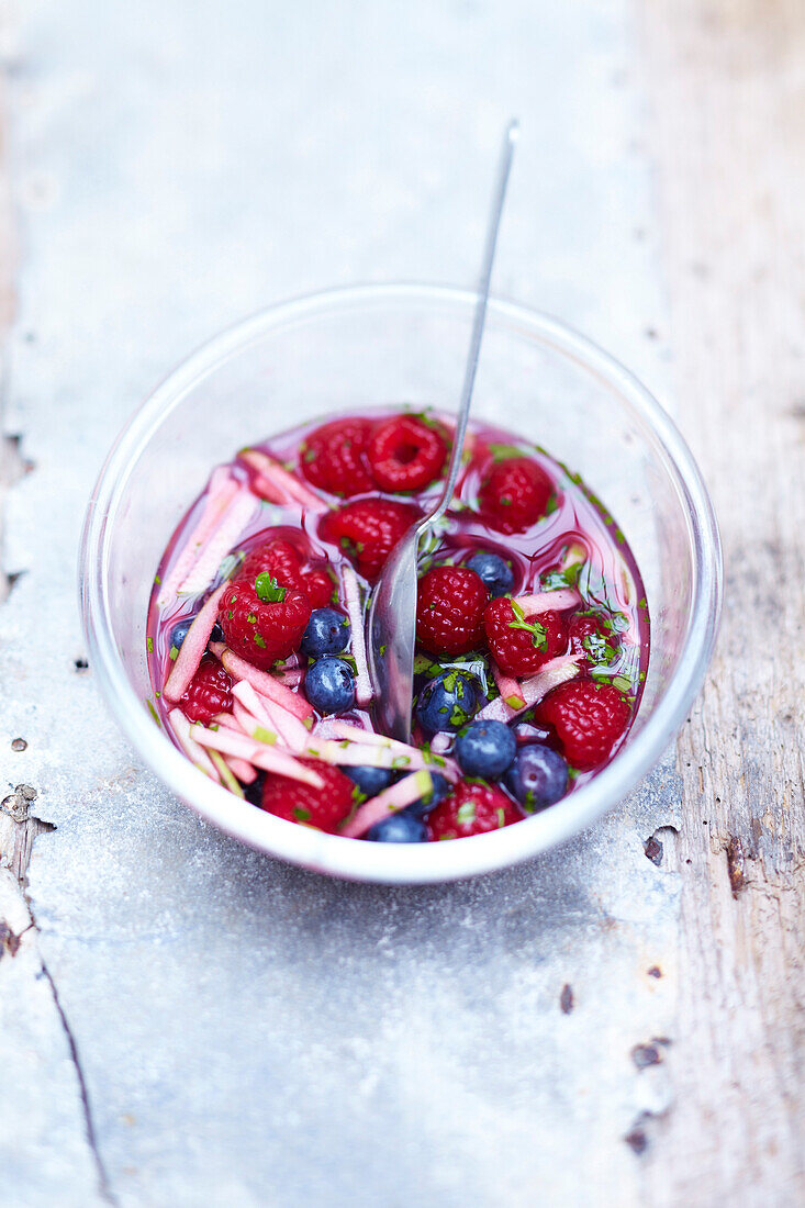 Red fruit soup with apple sticks