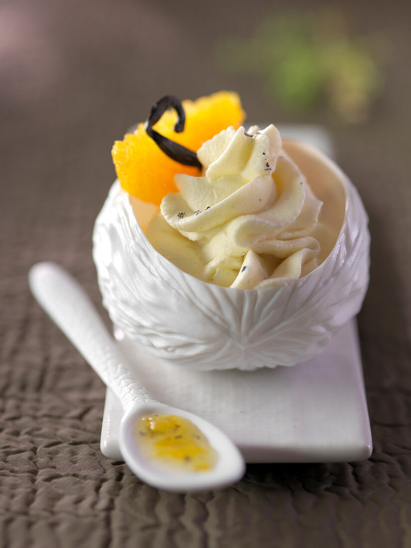 Orange cream dessert with vanilla-flavored whipped cream