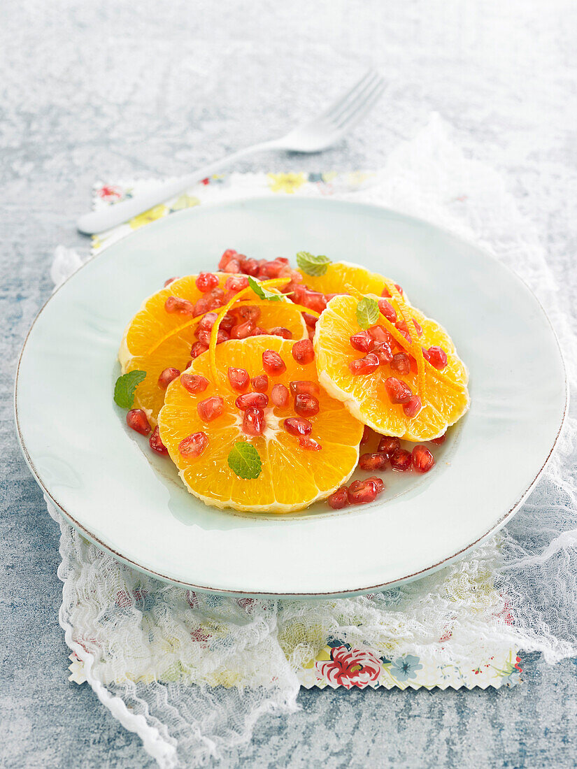 Orange carpaccio with pomegranate seeds