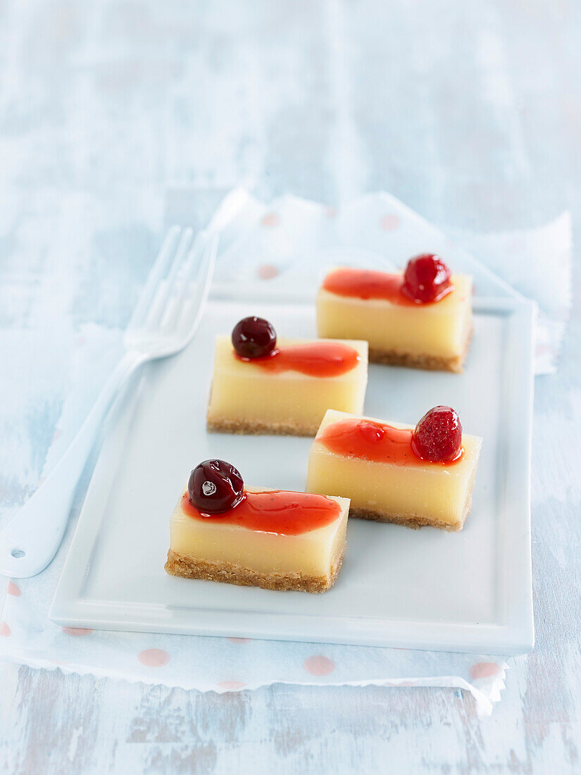Lemon-mint jelly bites and red fruit coulis