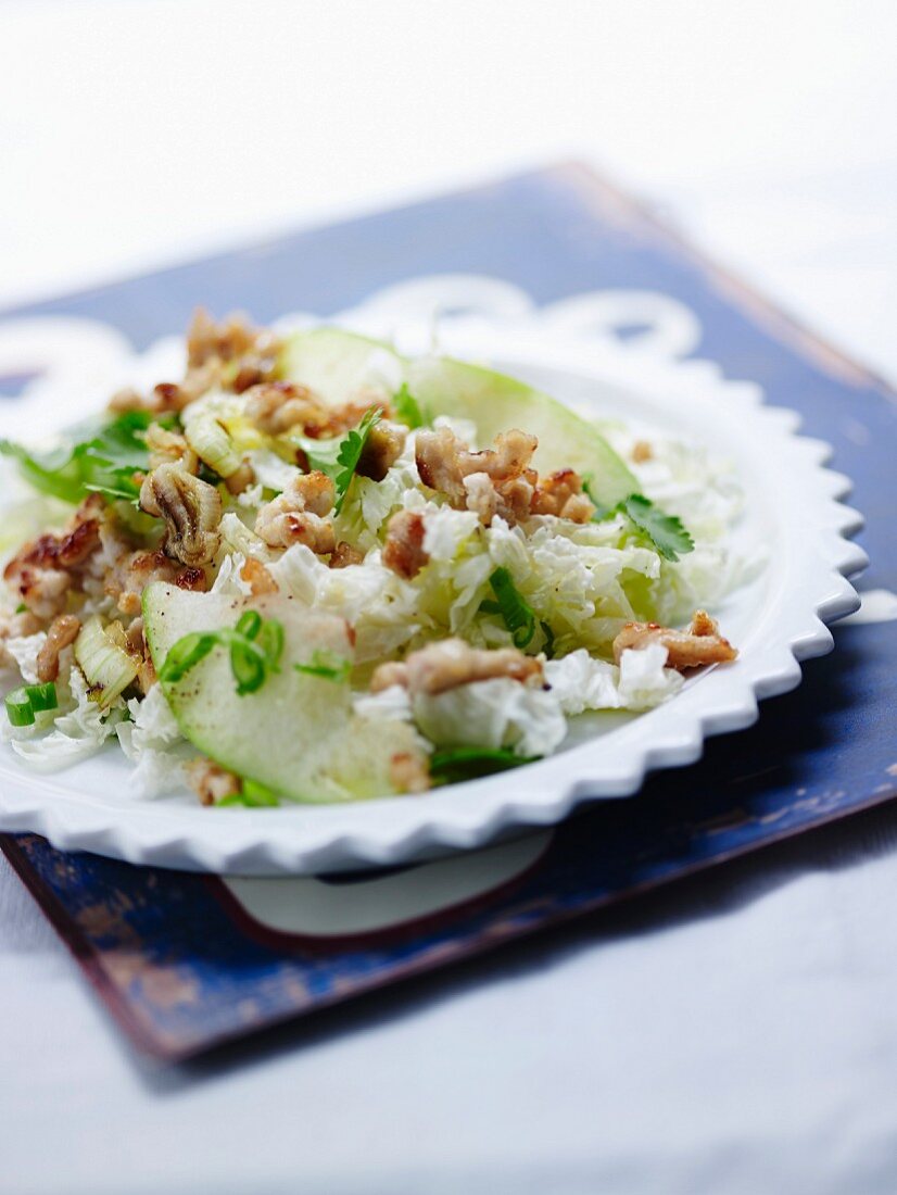 Warm salad with Chinese cabbage, pork, and basil and ginger oil