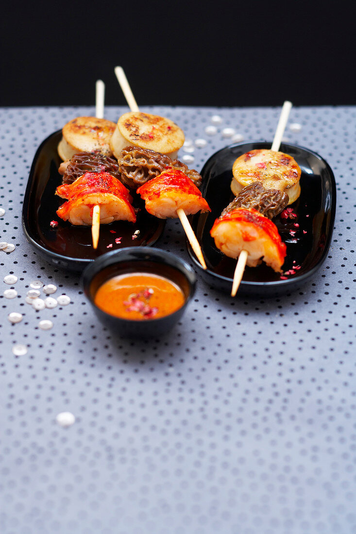 White sausage, morel and lobster brochettes, red hot pepper sauce