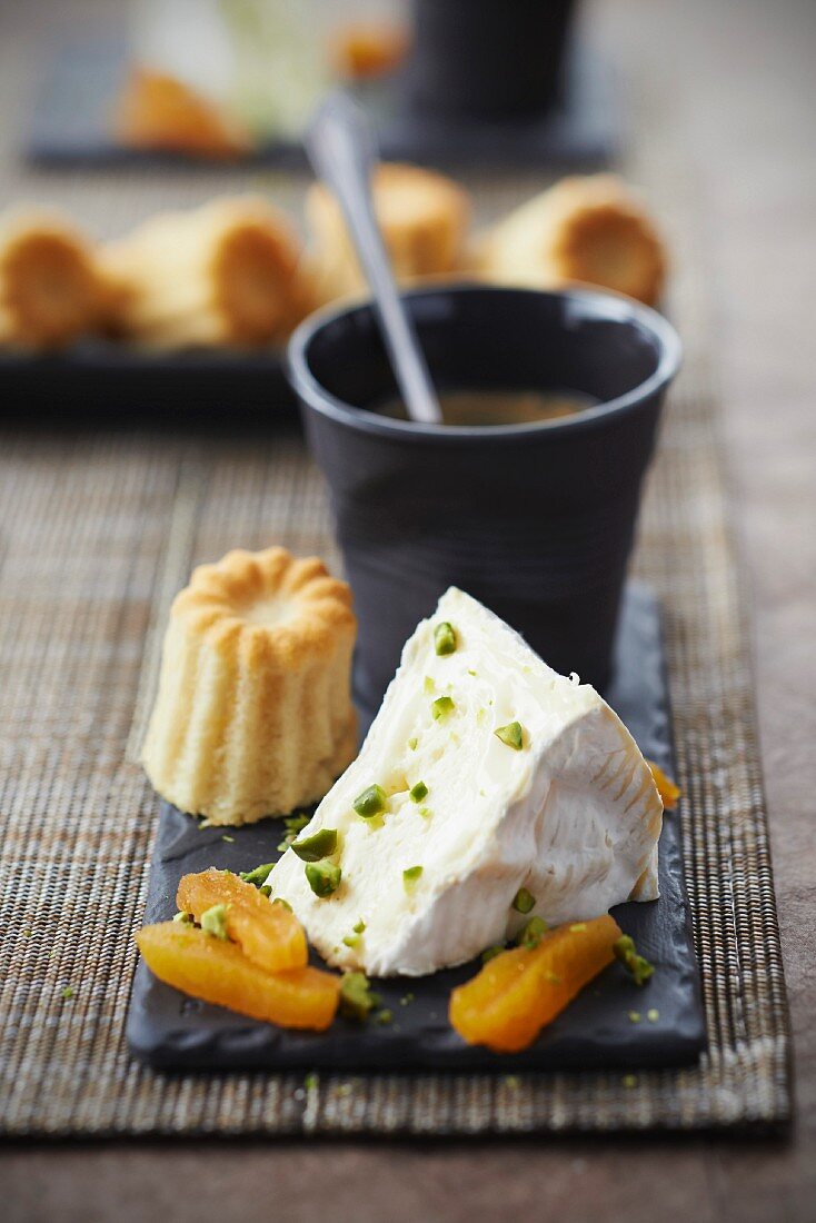 Camembert with dried apricots and pistachios,cardamom Cannelés