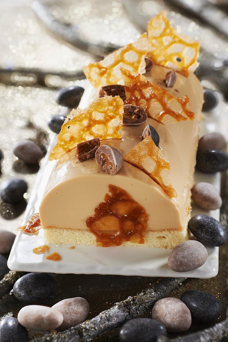 Caramel panna cotta,crumbled orange tuiles and toffee beans