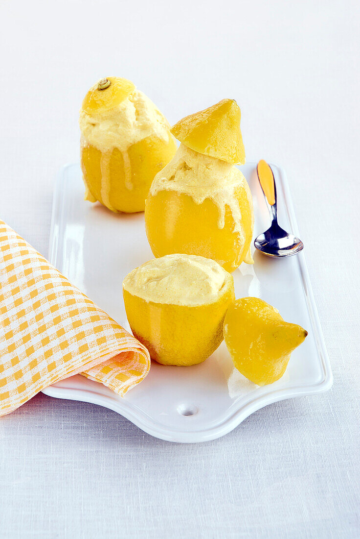 Lemon frozen yogurt served in hollowed out lemons