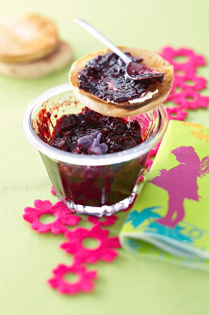 Toasted muffin with blueberry and raspberry jam