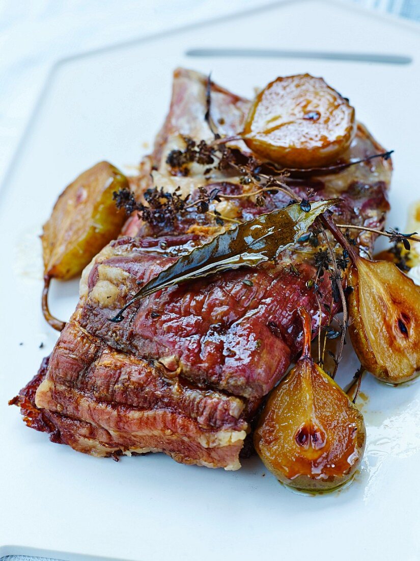 Confit pork breast and roasted pears with bay leaves and thyme