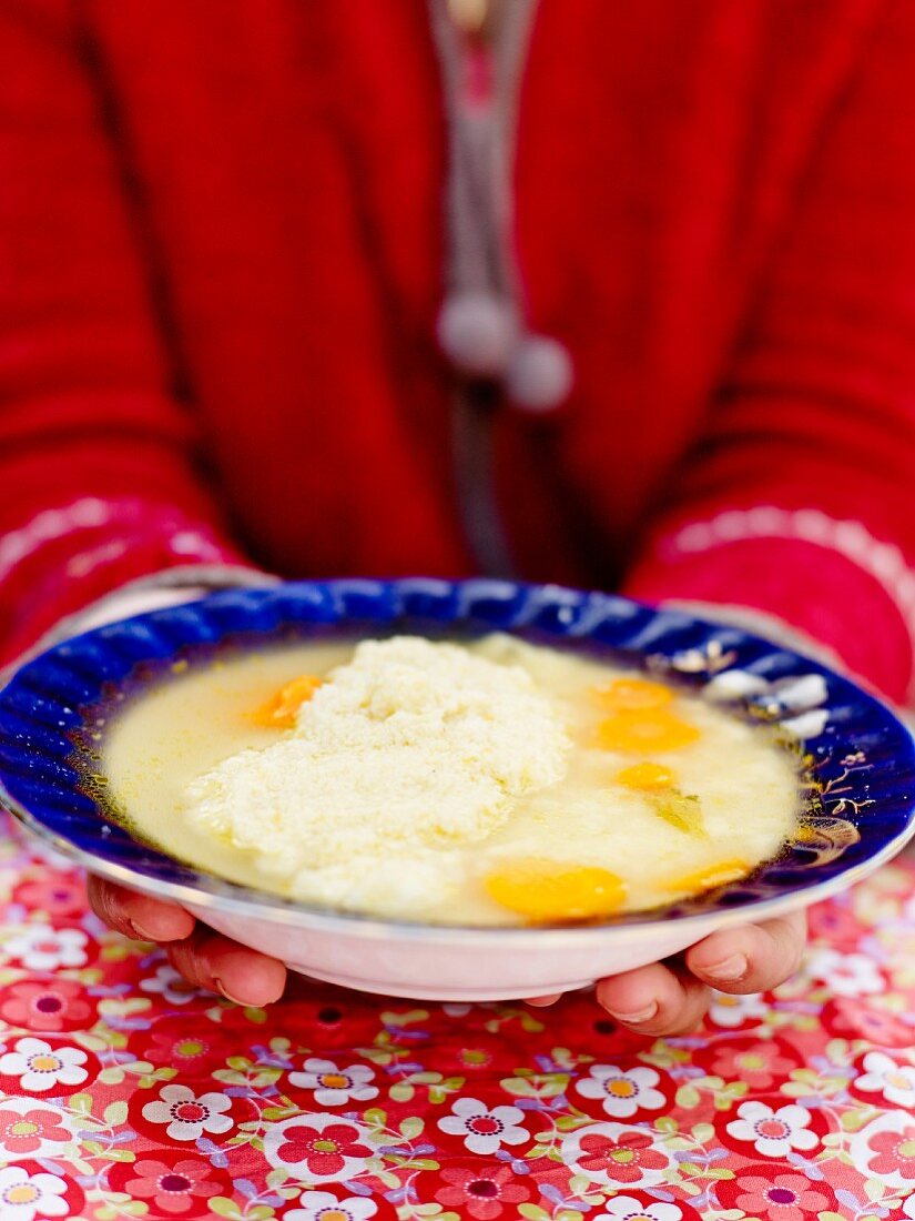 Chicken broth with semolina, eggs and carrots