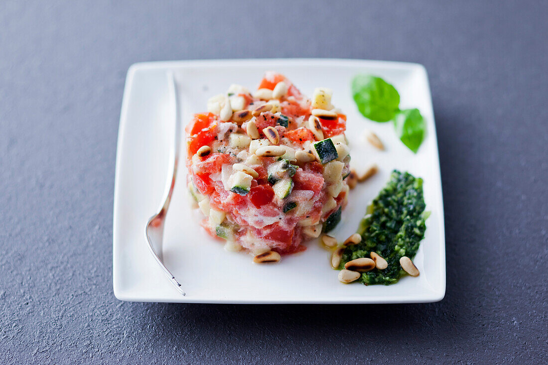 Tomato tartar with zucchini and pine nuts