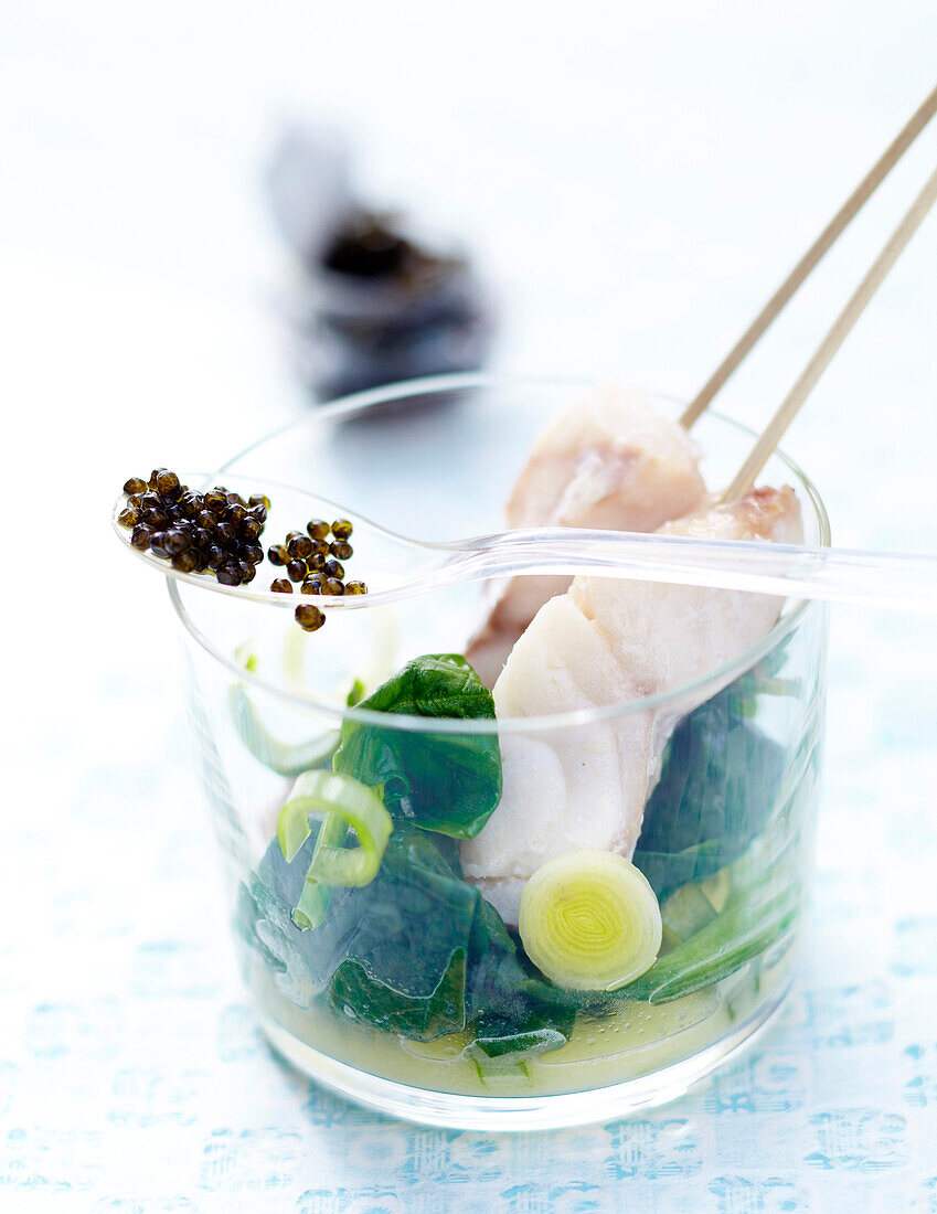 Mini fish brochettes with caviar and fresh spinach