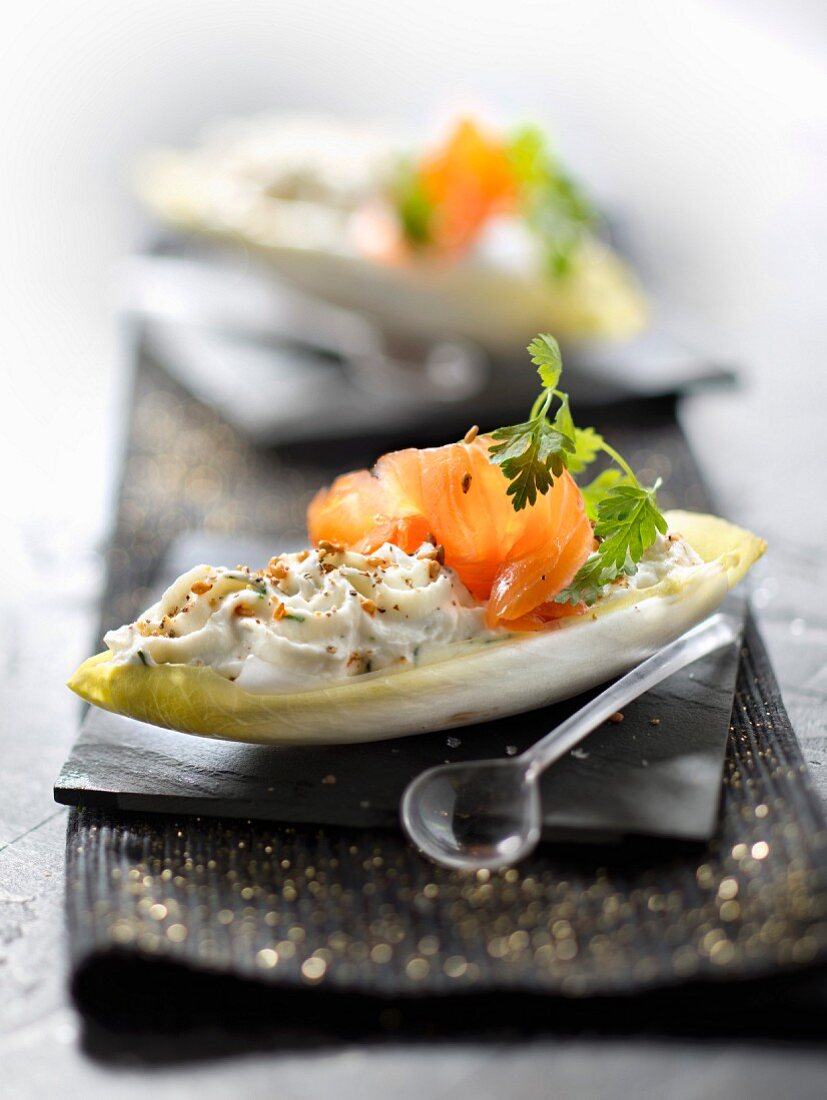 Crisp chicory leaves garnished with ricotta, dill and smoked salmon