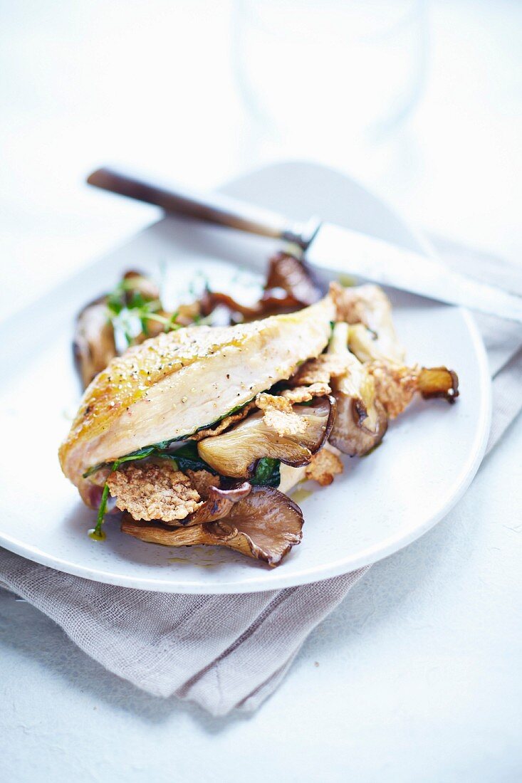 Guinea fowl breast with crispy cereals and mushrooms