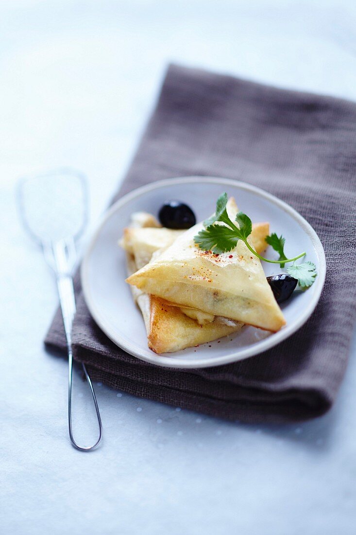 Brick pastry parcels with goat's cheese and olives