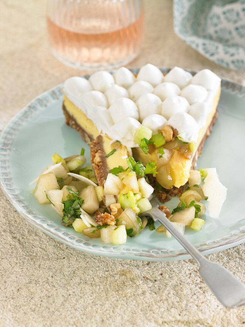 Slice of nutty gorgonzola cheesecake, celery, grape, pear and parmesan salad