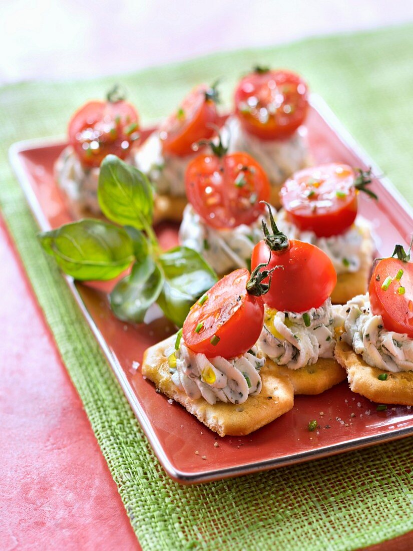 Herby cream cheese and cherry tomato Tuc cracker appetizers