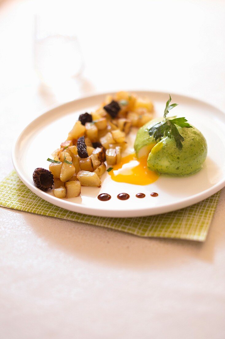 Soft-boiled egg in parsley bechamel sauce,sauteed potatoes and morels