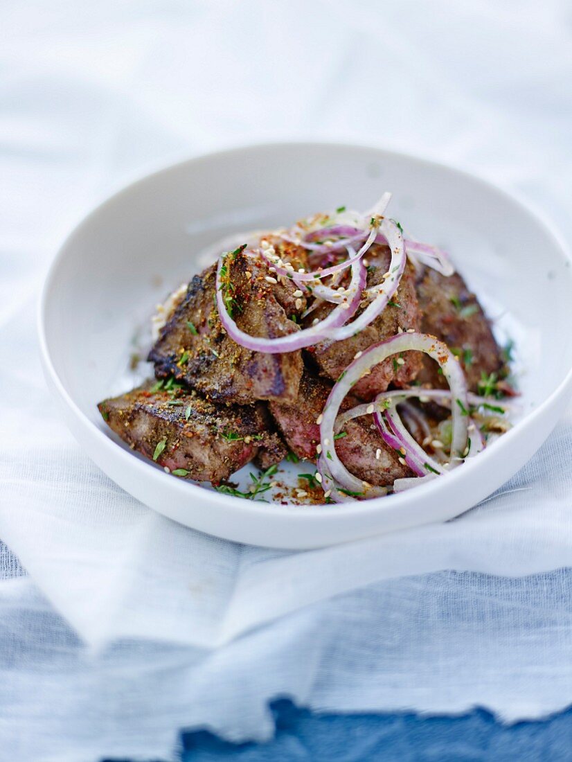 Spicy fried lamb's liver ,red onion salad