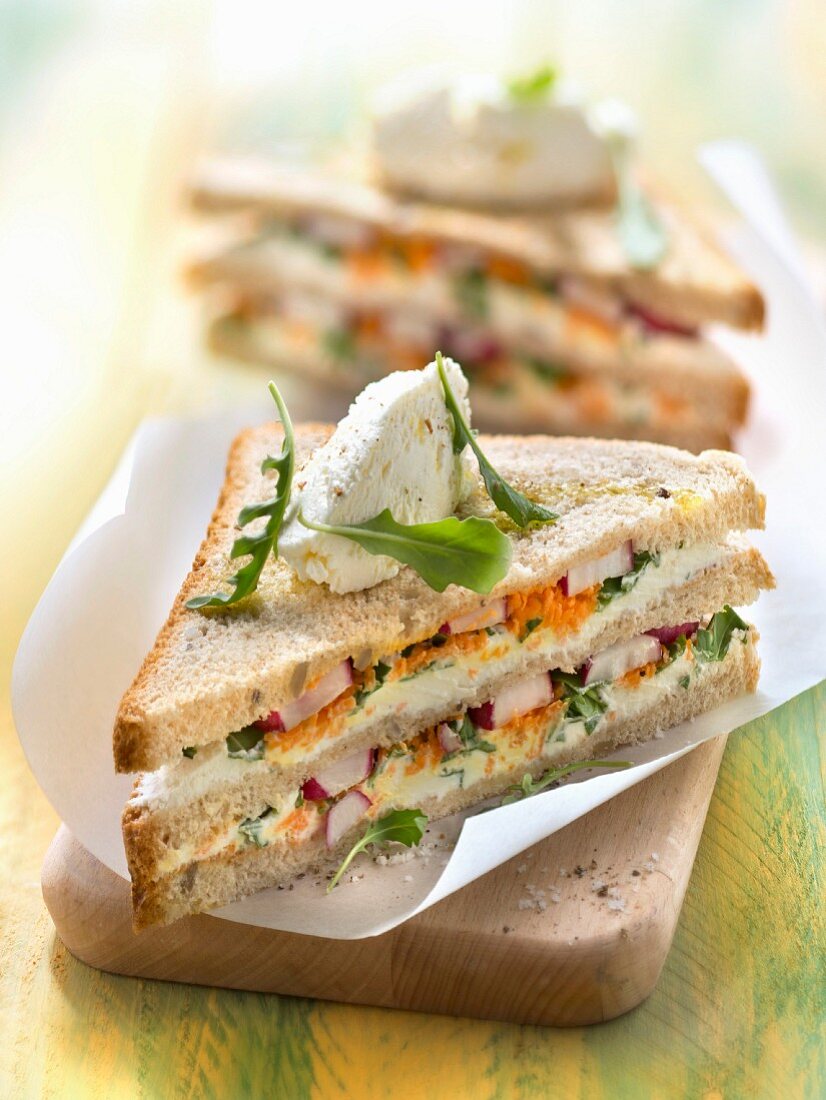 Vegetarian Philadelphia cheese, radish, rocket lettuce and carrot club sandwich