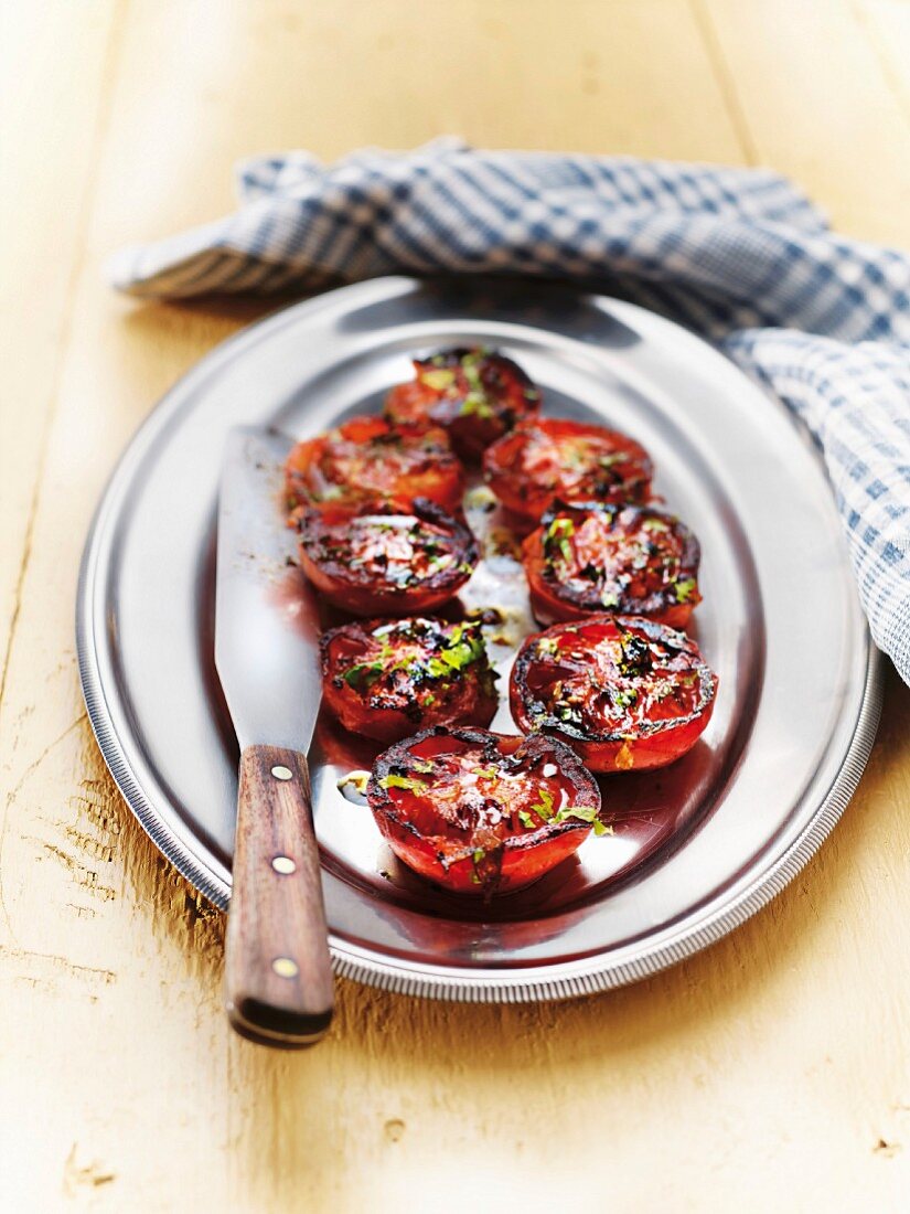 Grilled tomatoes with fresh herbs