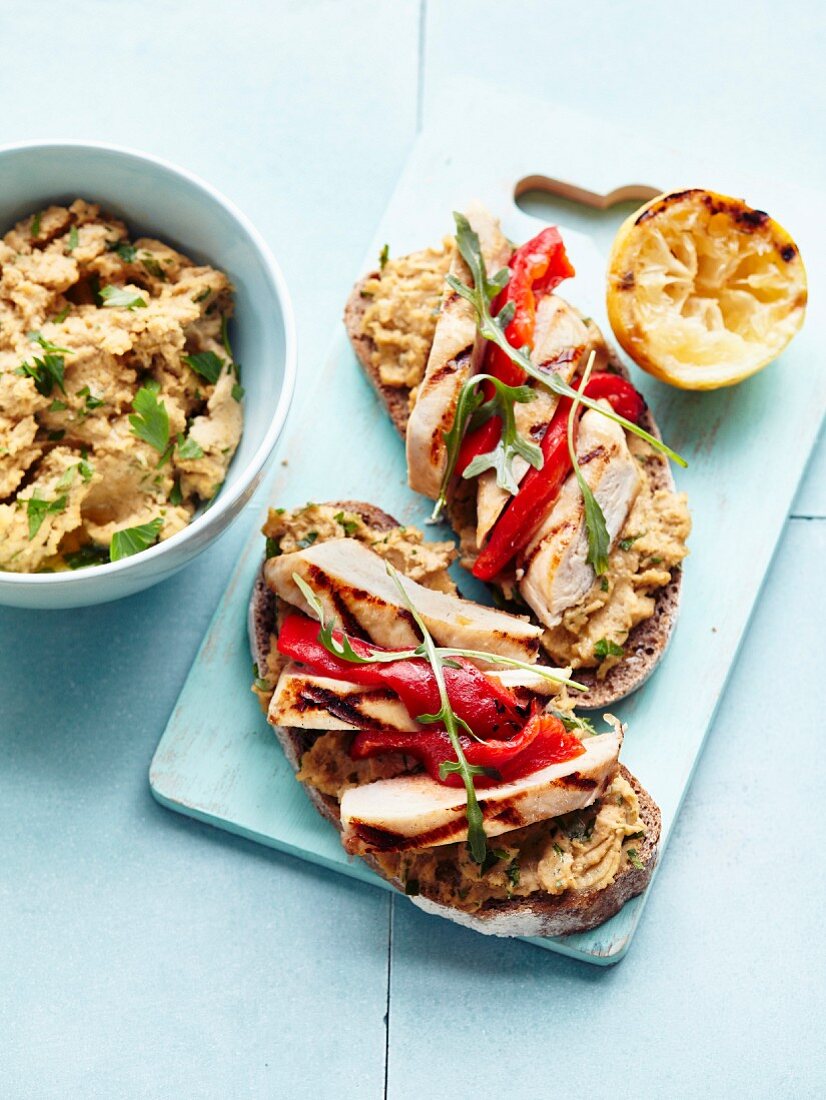 Chickpea and coriander spread,grilled chicken,stewed red pepper and basil open sandwiches