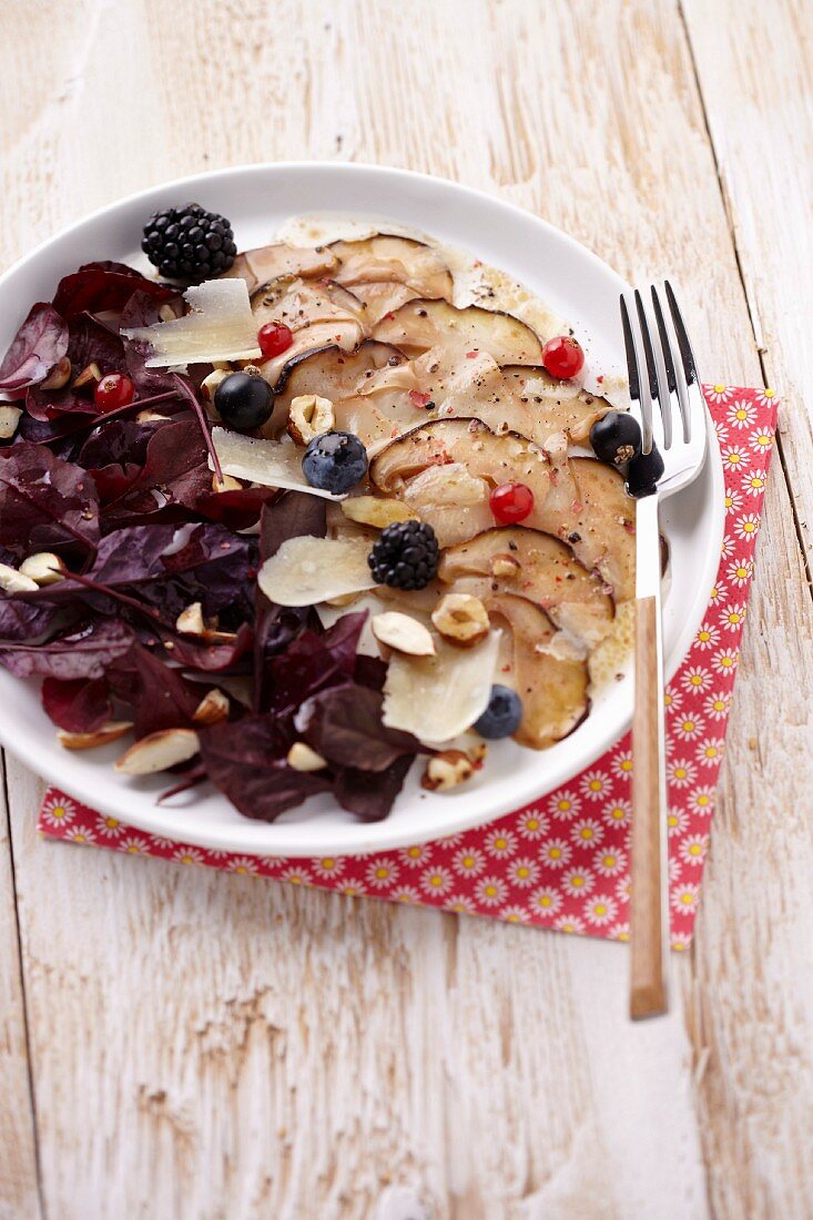 Cep carpaccio with wild berries and dried fruit,purple basil