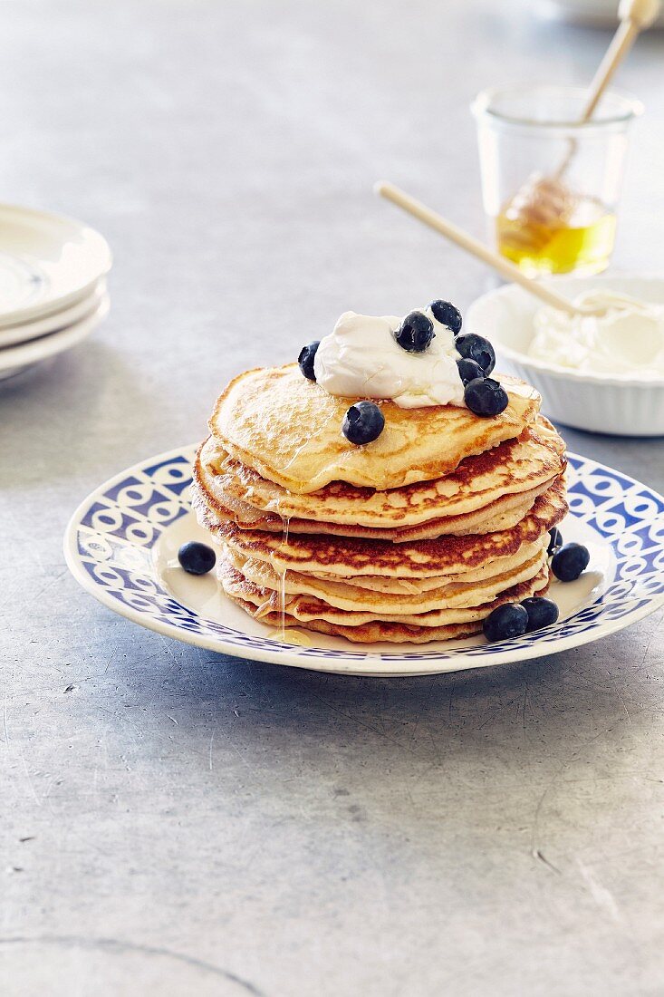 Pancakes with cream cheese, honey and blueberries