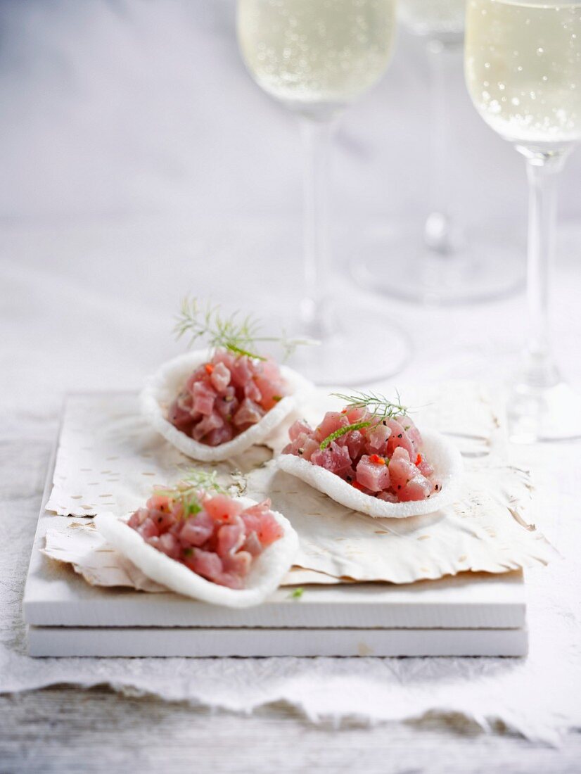 Asian crisps garnished with shrimps and tuna tartare