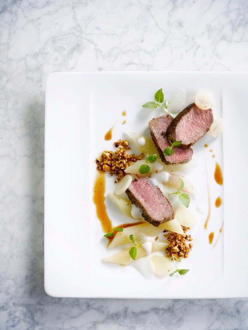 Veal fillet with salsifies and crushed walnuts