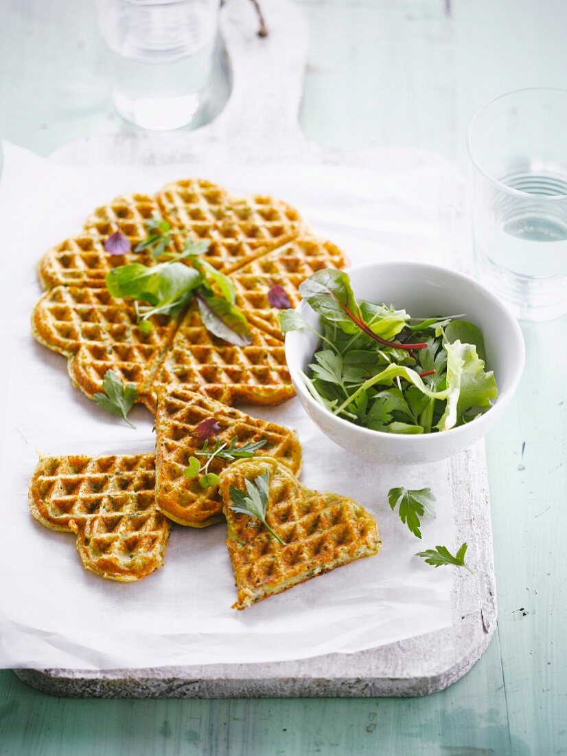 Spicy potato wafles with mixed lettuce salad