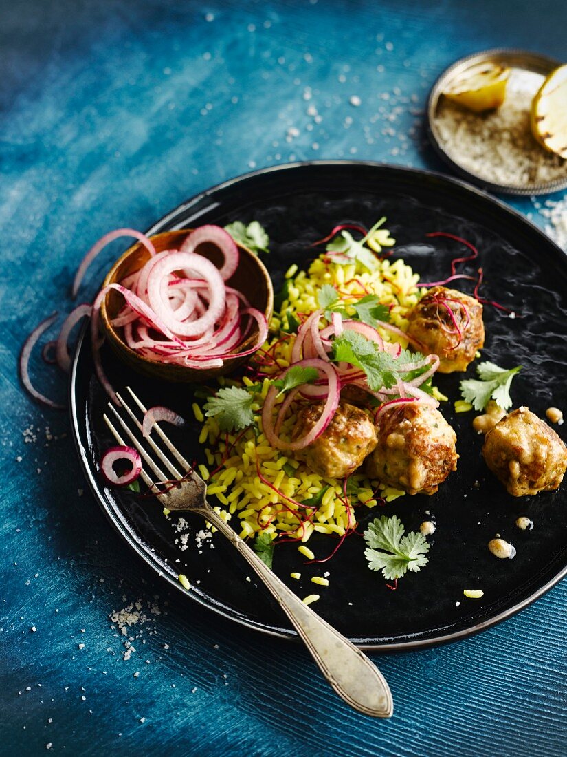 Turkey meatballs and yellow rice with red onions