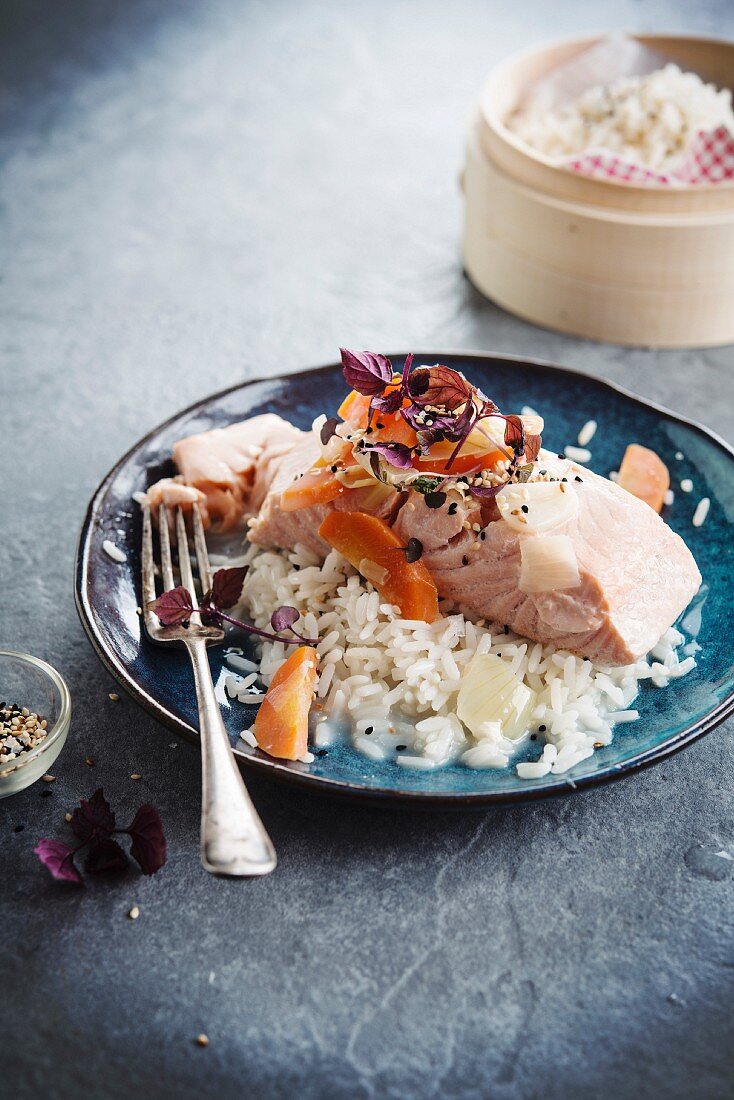 Poached salmon with carrots and rice with coconut milk