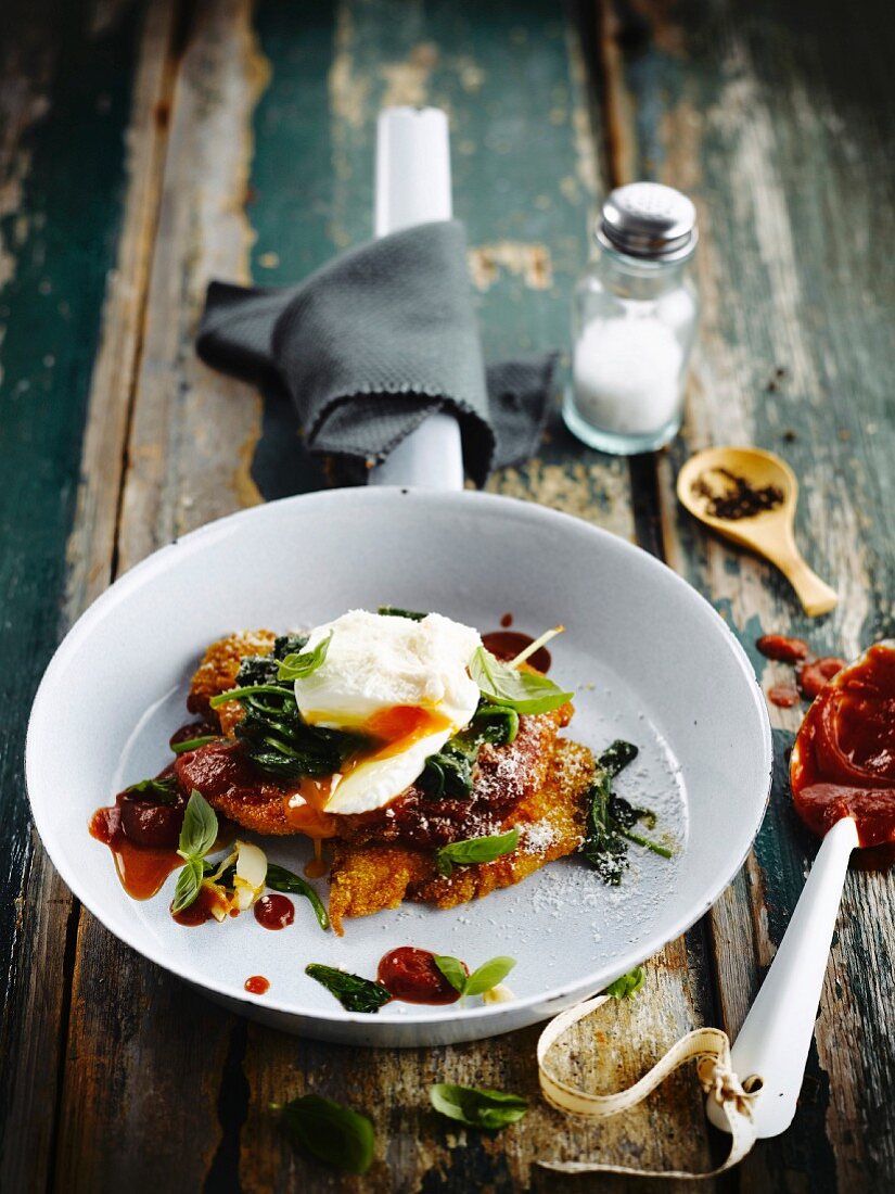 Polenta Schnitzel with spinach and a poached egg