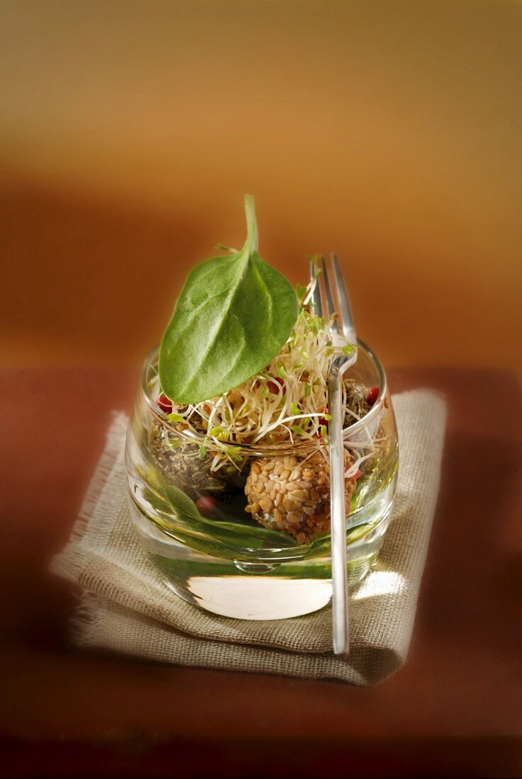 Fromage frais balls coated with mixed seeds, sprouts and spinach Espuma