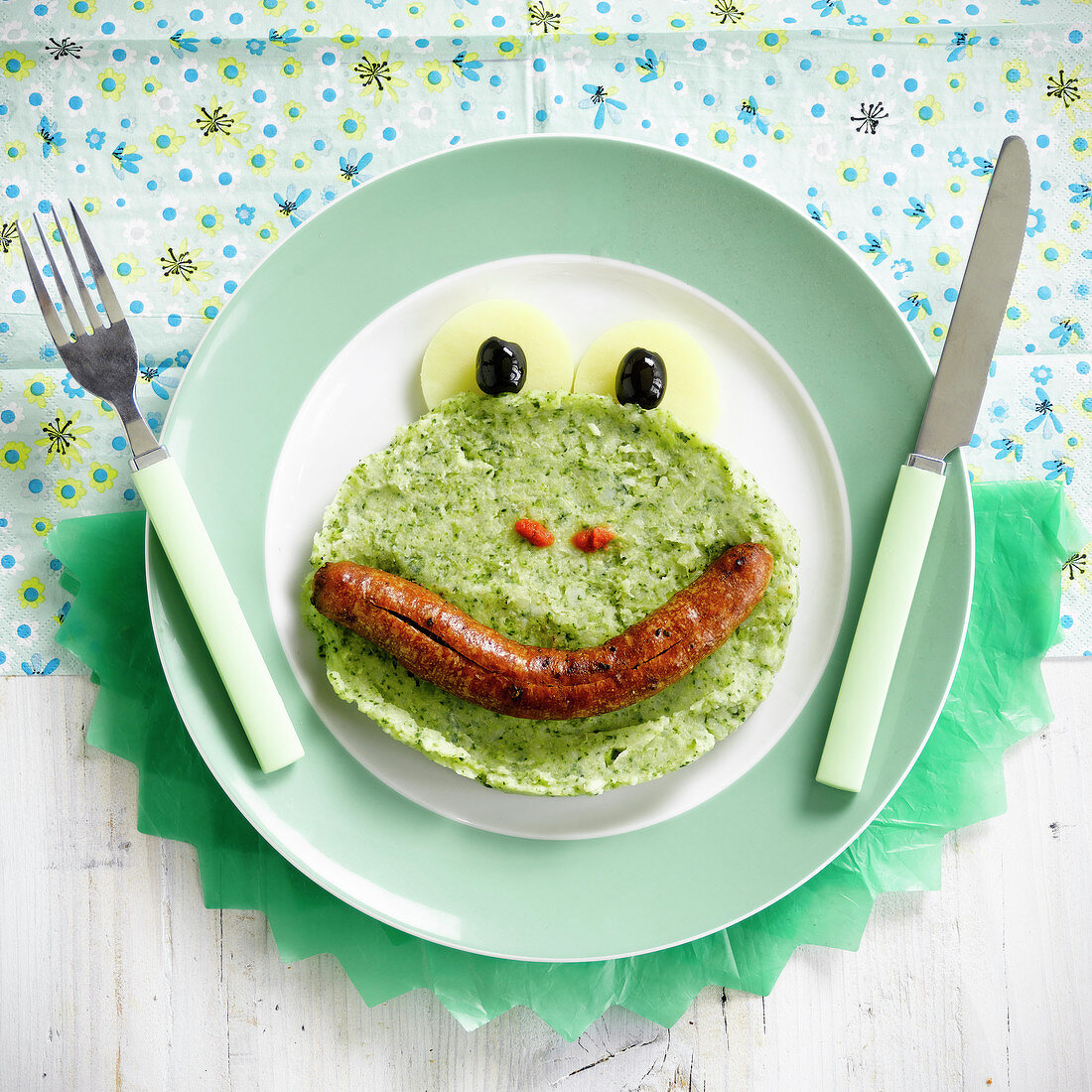 Funny face mashed broccolis and sausage